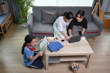 Three asian girl sitting in comfortable home and enjoy leisure weekend together.