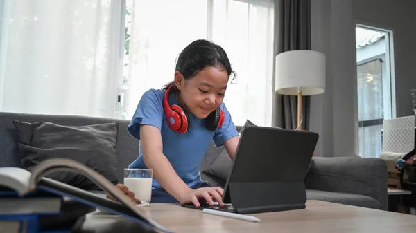 Happy Asian Girl Watching Cartoons Online Digital Tablet While Sitting — Φωτογραφία Αρχείου