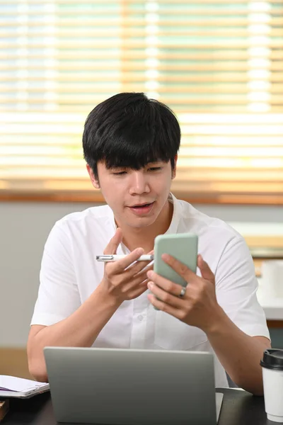 Young Asian Man Having Video Call Smart Phone His Friends — Φωτογραφία Αρχείου