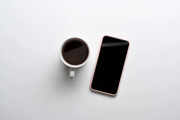 Top View Mock Mobile Phone Coffee Cup White Background — Zdjęcie stockowe