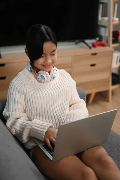 Happy Young Asian Girl Sitting Sofa Using Laptop Computer — Stockfoto