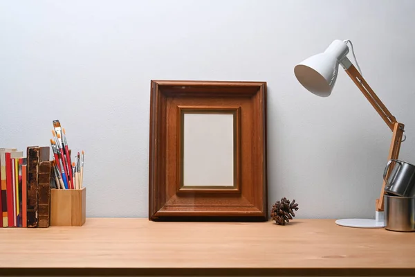 Stylish Workplace Empty Photo Frame Lamp Pencil Holder Book Wooden — Stock Photo, Image