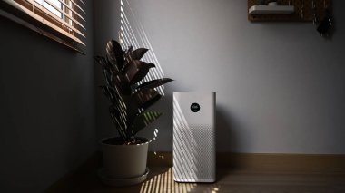Air purifier in modern house. Fresh air and healthy life. clipart