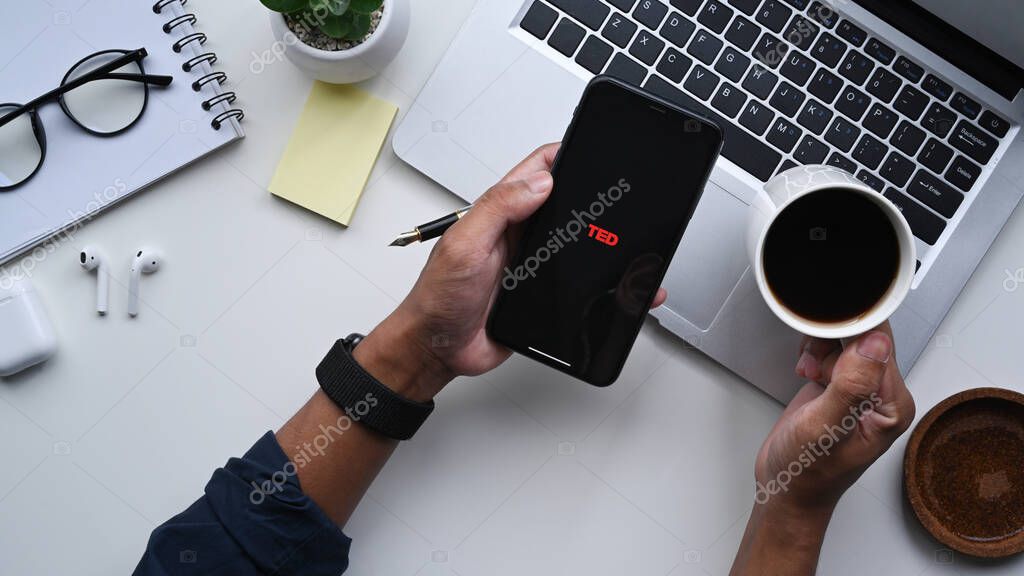CHIANGMAI, THAILAND - AUG 18, 2021 : Man holding iPhone 11 with icon TED talk application, TED talk is a media organization that posts talks online for free distribution.