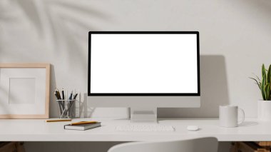 Masaüstü bilgisayarı, ofis malzemeleri, ev bitkisi ve kitaplarıyla 3B çalışma alanı.