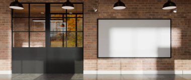 Modern endüstriyel ofisin cam kapısının yanındaki tuğla duvarda büyük boş çerçeve modelleme.