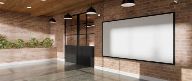 Modern endüstriyel ofisin cam kapısının yanındaki tuğla duvarda büyük boş çerçeve modelleme.