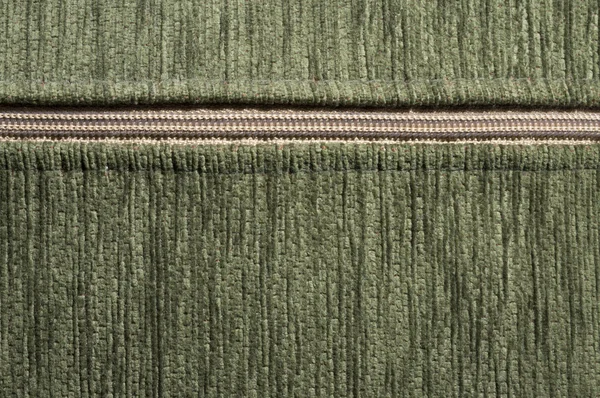 Фон синтетической зеленой ткани с молнией — стоковое фото