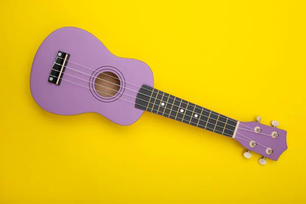 Four String Ukulele Guitar Yellow Background — Stock Photo, Image