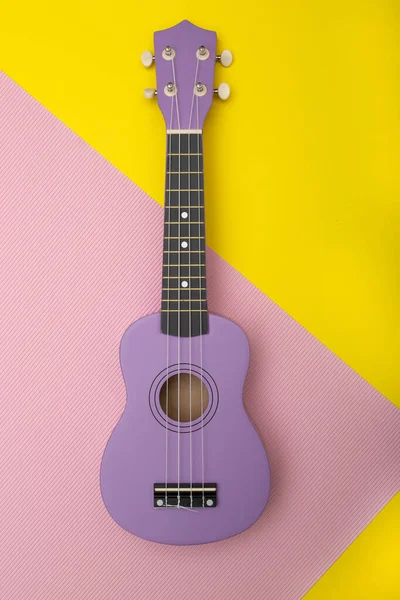 Four String Ukulele Guitar Colored Background Top View — Stock Photo, Image