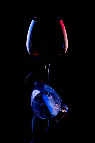 Still life with glass objects on a black background