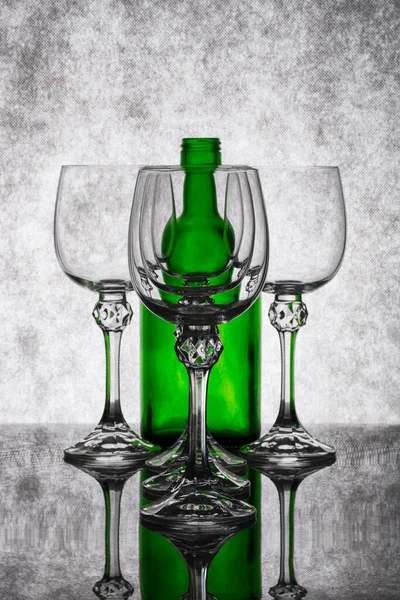 Still Life Empty Glass Goblets Green Bottle — Stock Photo, Image