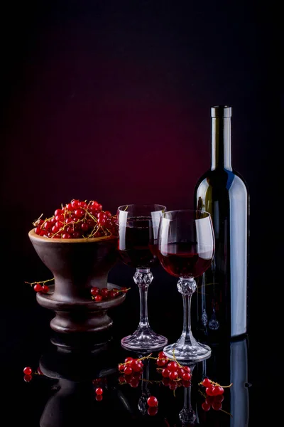 Still life with red currant and red wine
