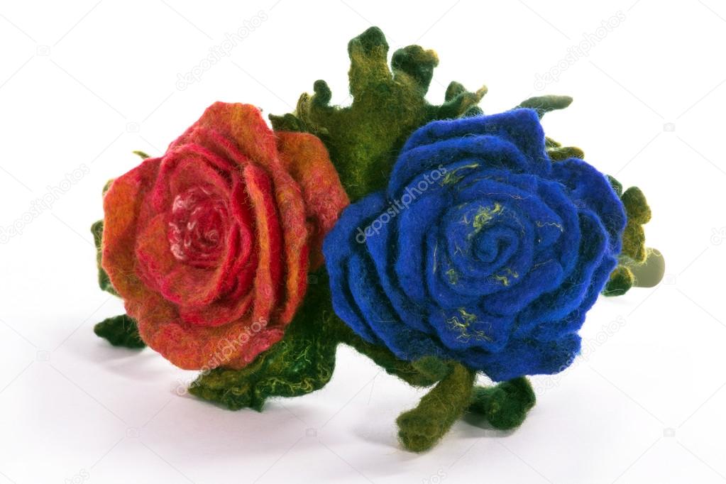 Wrap hair with a decorative ornament in the form of flowers from fulled wool on a white background