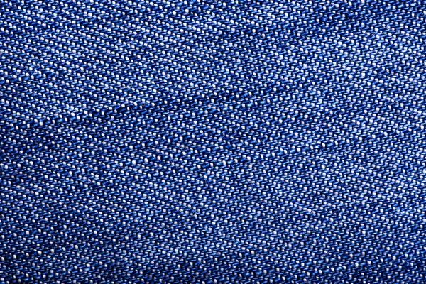 Tło i tekstura dżinsowej tkaniny zbliżenie — Zdjęcie stockowe