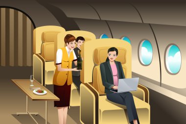 Birinci sınıf yolcular uçuş görevlisi tarafından sunulmakta