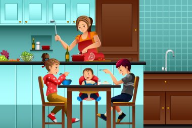 Mutfakta çocuklarıyla meşgul anne