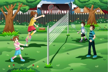 Arka bahçede badminton oynamaya aile