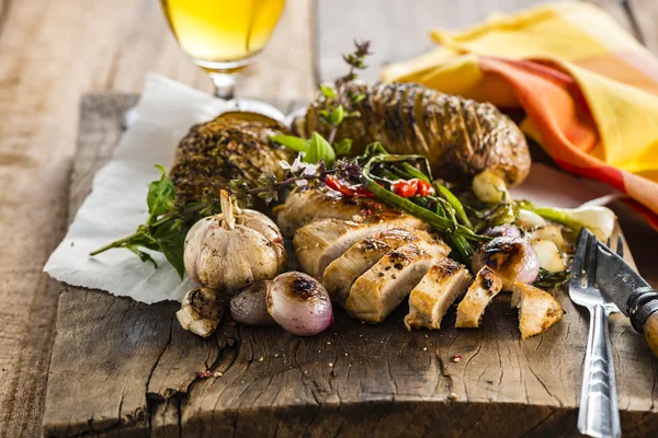 Chicken breast on wood plate — Stock Photo, Image