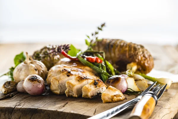 Chicken breast on wood plate — Stock Photo, Image