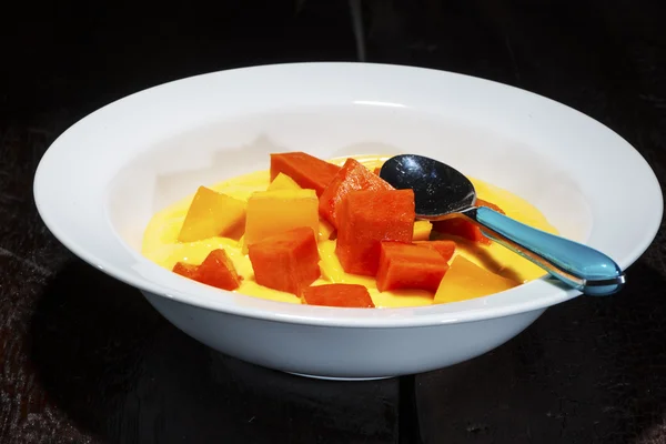 Plate with pudding and fruits — Stock Photo, Image