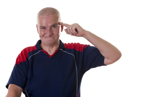 Äldre man med tanken sätter fingret på templet — Stockfoto