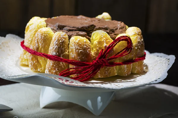 Chocolate cake decorated with pastries — Stock Photo, Image