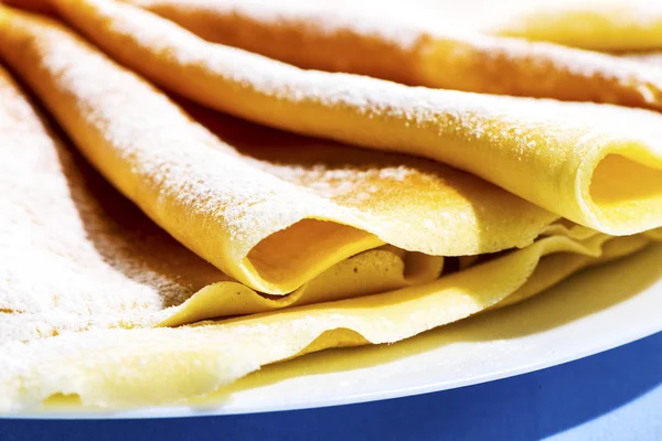 Freshly baked golden pancakes or crepes — Stock Photo, Image