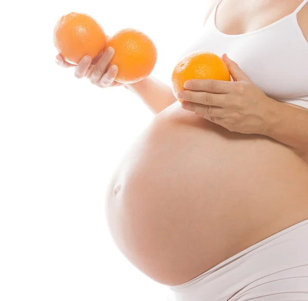 Pregnancy belly closeup studio shot — Zdjęcie stockowe