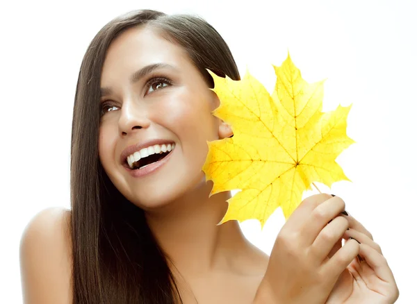 Woman beauty closeup portrait with yellow leave face skin — Stock fotografie