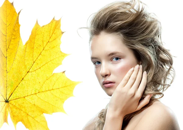 Woman beauty closeup portrait with yellow leave face skin — Stock Photo, Image