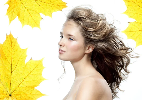 Woman beauty closeup portrait with yellow leave face skin — Zdjęcie stockowe