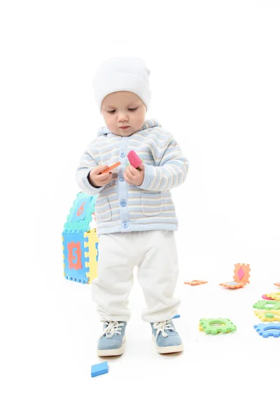 Little child baby playing with puzzles — Stock Photo, Image