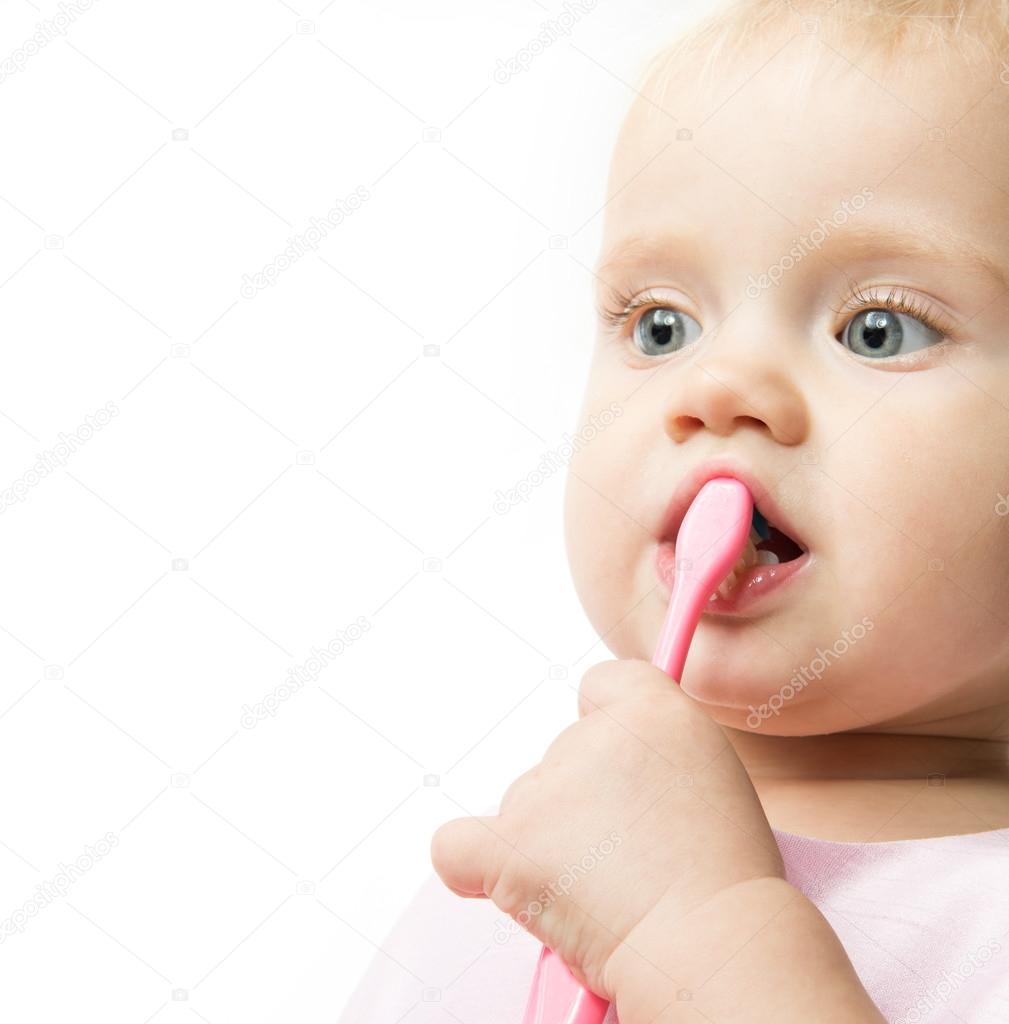 Little child baby brushing teeth Stock Photo by ©dedukh 98795630