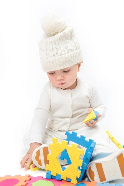 Little child baby playing puzzles — Stock Photo, Image