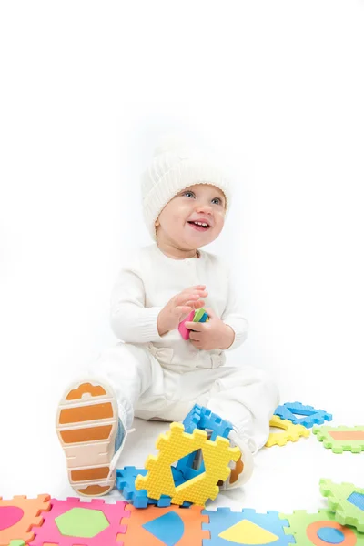 Little child baby playing with puzzles — Stock Photo, Image