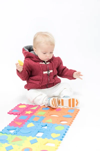 Little child baby playing with puzzles — Stock Photo, Image