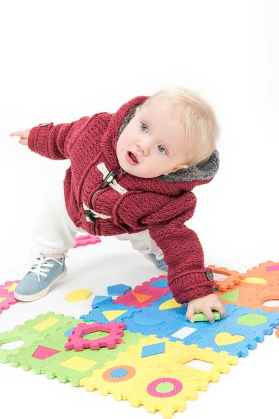 Little child baby playing with puzzles — Stock Photo, Image