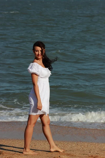 Sexy young Caucasian female model posing over the the Black Sea,Crimea, Russia