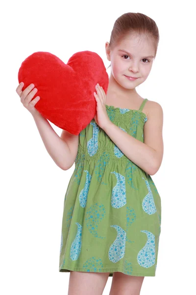 Criança bonita com símbolo de coração — Fotografia de Stock