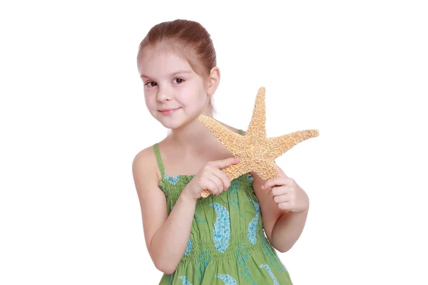 Little girl holding marine life — Stock Photo, Image