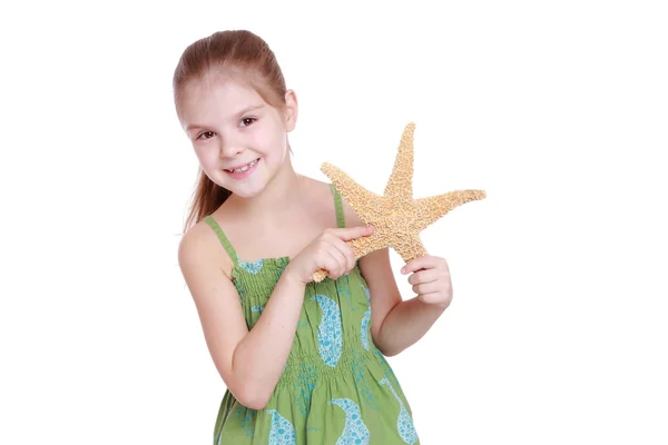 Little girl holding marine life — Stock Photo, Image