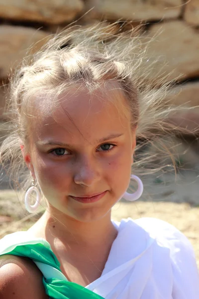 Charming smiling young girl in a Greek tunic — ストック写真