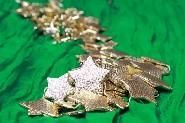 Golden stars over green background — Stock Photo, Image