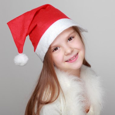 Mutlu gülen portresi Noel Baba şapkası, küçük kız