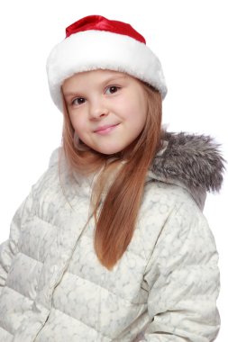 Bir Noel Baba'nın şapka neşeli bir kızla tatil portresi