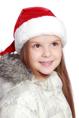 Bir Noel Baba'nın şapka neşeli bir kızla tatil portresi