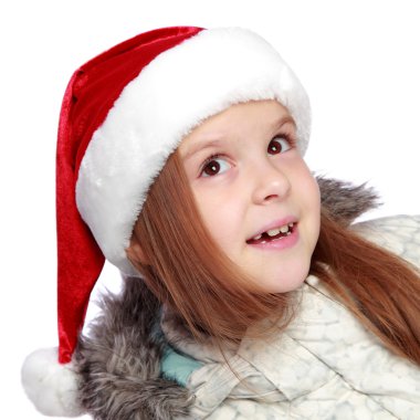 Bir Noel Baba'nın şapka ile neşeli bir kız portresi