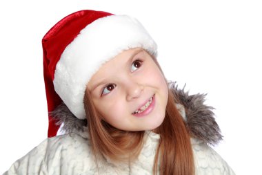 Bir Noel Baba'nın şapka neşeli bir kızla tatil portresi