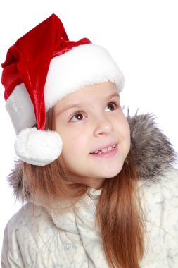 Bir Noel Baba'nın şapka neşeli bir kızla tatil portresi